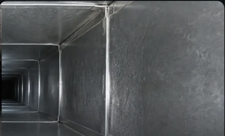 The same HVAC duct interior after cleaning, clean metal surfaces — DCC field photo