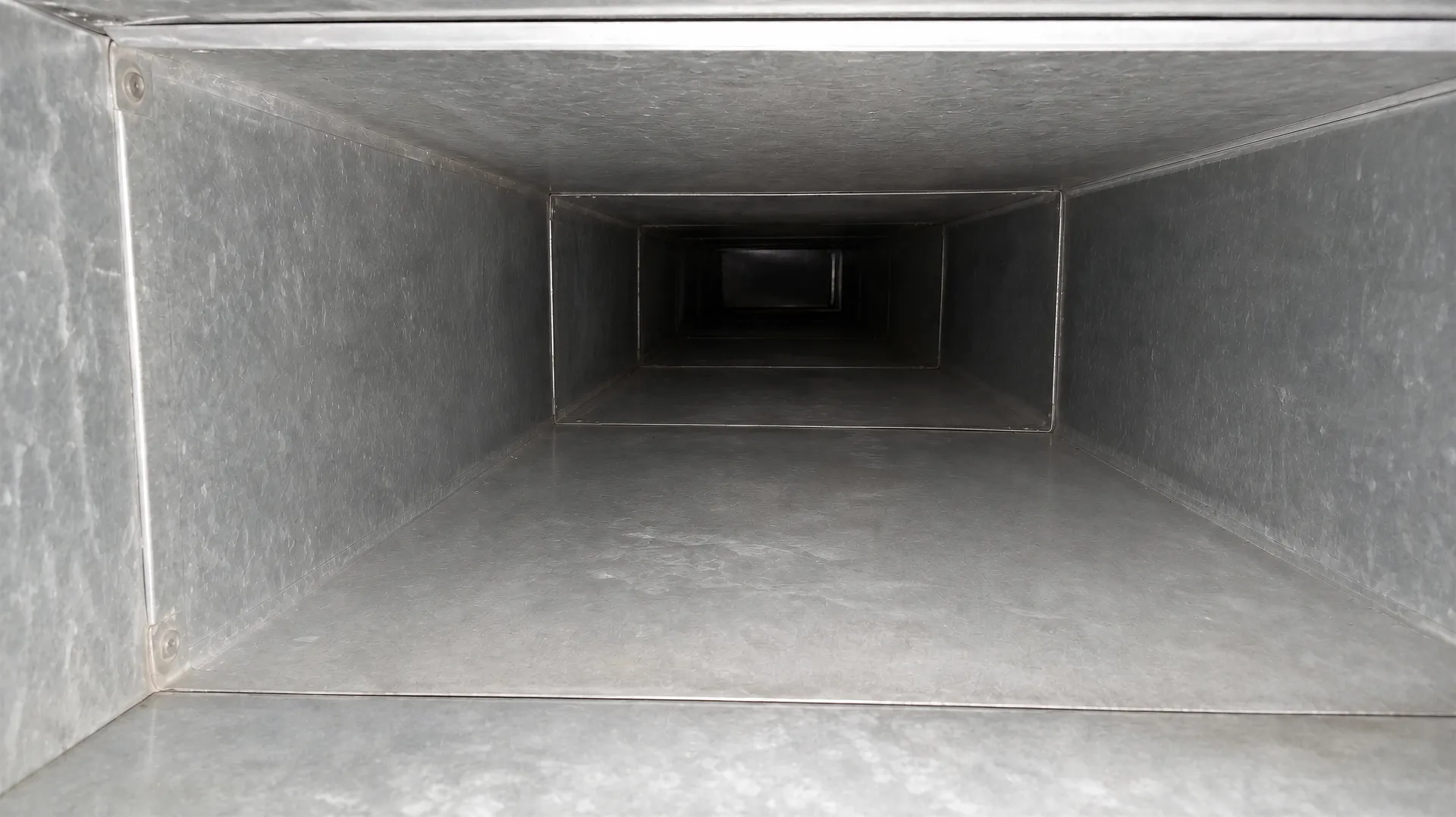 Duct run cleaned to bare metal after DCC cleaning — field photograph