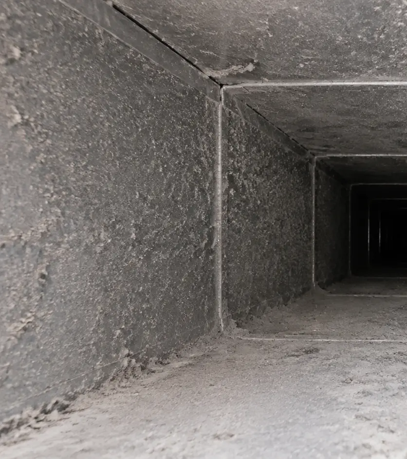 Representative inspection view showing deposits inside an air duct before cleaning